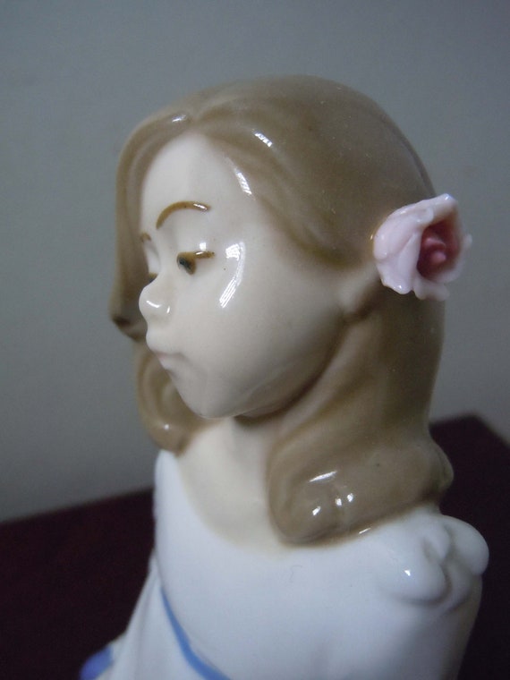 Enrique Nadal Porcelain Girl Sitting on a Cushion With Pink Flower