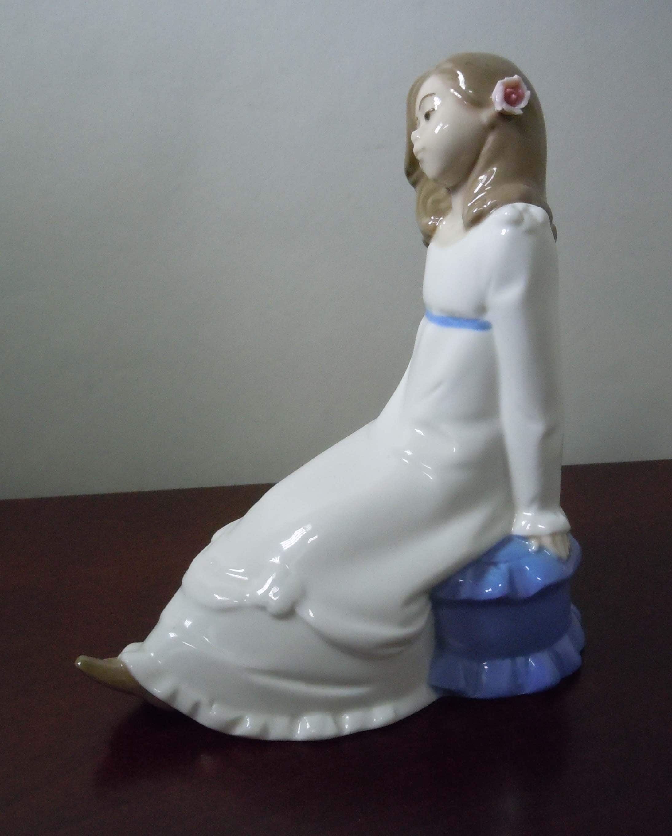 Enrique Nadal Porcelain Girl Sitting on a Cushion With Pink Flower