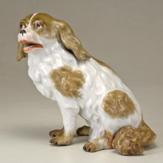 A 20th Century Meissen Porcelain Model of a Sitting Dog in White