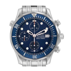 May include: A stainless steel wristwatch with a blue dial and bezel. The watch features a chronograph function with multiple sub-dials and a date display. The dial has a wave pattern, and the bezel is marked with numerals. The watch is water-resistant to 1000 feet.