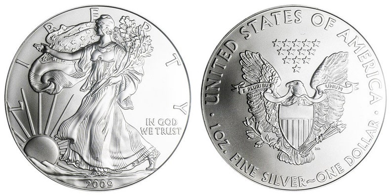K&ouml;nnte beinhalten: Eine silberne American Eagle M&uuml;nze mit einer Darstellung von Lady Liberty auf der Vorderseite und einem Adler mit einem Schild auf der R&uuml;ckseite. Die M&uuml;nze ist mit 2009 datiert und tr&auml;gt die Inschriften "In God We Trust" und "United States of America, 1 oz. Fine Silver - One Dollar".