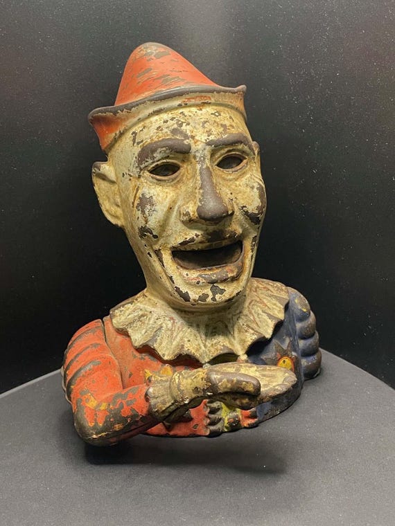 A Shepard Hardware Cast Iron Humpty Dumpty Mechanical Clown Bank