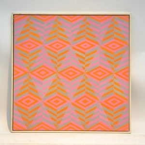 May include: Abstract geometric artwork featuring a repeating pattern of diamonds and chevrons in grey, pink, and orange. The painting is presented in a light-coloured wooden frame.