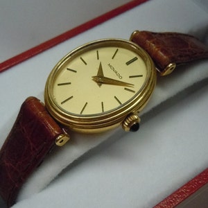 Vintage Ladies 18K Gold Oval Movado Champagne Stick Statement Watch Sapphire Cabochon Crown Fancy Lugs