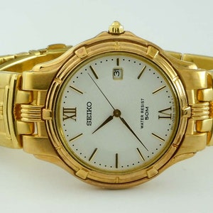 Vintage Mens Gold Tone Stainless 8N0516 Seiko Calendar Statement Watch