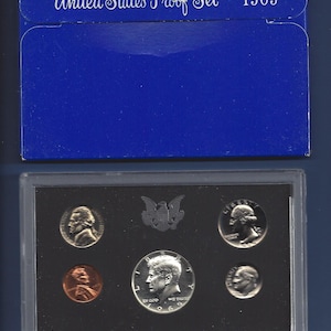 May include: A blue United States Proof Set 1969 coin collection in a plastic case. The set includes a half dollar, quarter, dime, nickel, and a penny.
