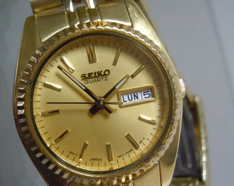 Reloj Seiko 7N83-006 M de cuarzo para mujer, con calendario, fecha y día, estilo President, esfera color champán dorada con índices y fecha Presidential.
