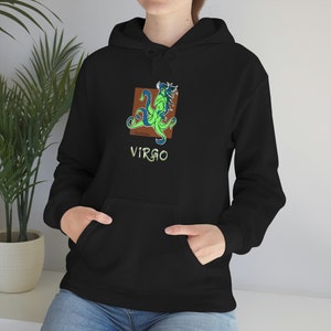 May include: Black hoodie with a green and blue Virgo zodiac sign illustration in a brown square. The text "VIRGO" is printed in green below the illustration.