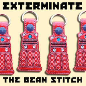 May include: Three red and white embroidered keychains shaped like a Dalek, a fictional robot from the British science fiction television series Doctor Who. The keychains are attached to silver key rings. The text "EXTERMINATE" is at the top of the image and "THE BEAN STITCH" is at the bottom.