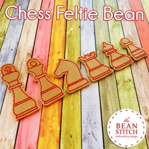 May include: Set of six felt chess pieces in tan with red stitching. The pieces include a king, queen, bishop, knight, rook, and pawn. The pieces are arranged on a colorful wooden background. The text "the BEAN STITCH embroidery design" is visible in the lower right corner.