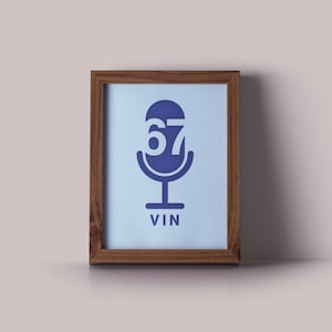 May include: A framed print with a blue microphone icon and the number 67 inside. The text "VIN" is below the icon.