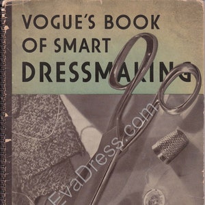 May include: A vintage book cover with the title "Vogue's Book of Smart Dressmaking" in black text on a light green background. The cover features a pair of silver scissors, a thimble, and buttons.