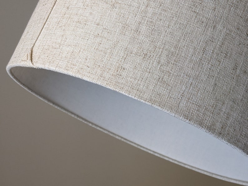 close up of bottom edge of handmade lamp shade in Calacatta Gold Flax fabric