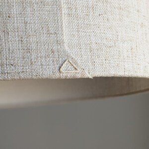 close up of back seam detail with cream colored triangle stitch detail