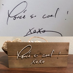 May include: A wooden sign with the words "You're so cool! xoxo" written in cursive on it. The sign is made of light brown wood and has a rustic look.