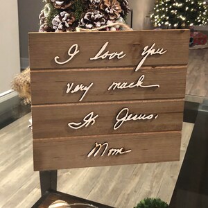 May include: Wooden sign with the words "I love you very much" and "From Mom" written in cursive.