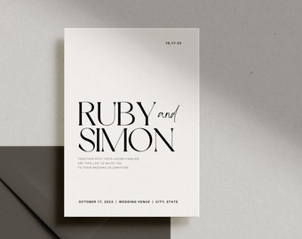 May include: A minimalist wedding invitation with a white background and black text. The invitation reads "RUBY and SIMON" with the date "OCTOBER 17, 2022" and the wedding venue, city, and state.