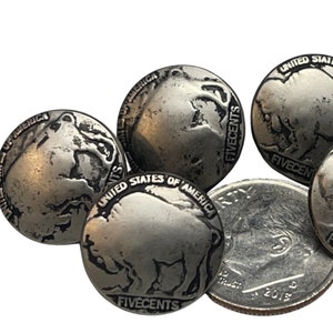 May include: Five silver-colored metal buttons with a buffalo design and the words "United States of America" and "Five Cents" engraved on them.