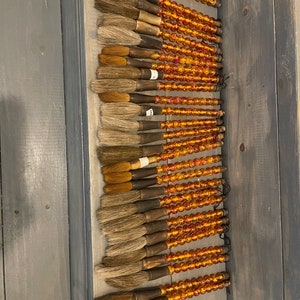 Calligraphy Brush featuring dark orange or auburn stones and ox bone handle - approximately 9 1/2&quot; to 11&quot; in length