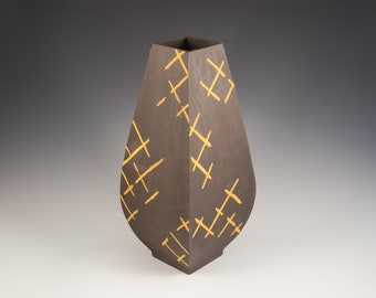 Broken Barriers. Tall, four sided brown vase with orange lines. Ceramics and pottery, pottery vase.