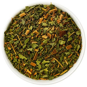 May include: A white bowl filled with a blend of loose leaf green tea and dried herbs.