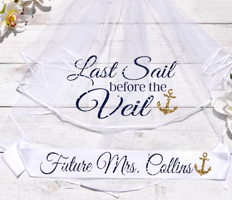 May include: White bridal veil with the text "Last Sail Before the Veil" in navy blue with a gold glitter anchor. A white satin sash with the text "Future Mrs. Collins" in navy blue with a gold glitter anchor.
