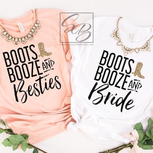 May include: Two t-shirts, one peach and one white, with the text "Boots, Booze, and Besties" and "Boots, Booze, and Bride" in black script. Each shirt has a gold glitter boot graphic. A necklace is draped on each shirt.