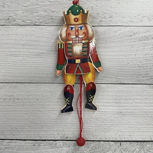 May include: A set of three ceramic mugs with a speckled, matte finish. The mugs are in shades of cream, light gray, and dark gray. Each mug has a simple, minimalist design, perfect for coffee or tea.