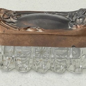 May include: A set of three ceramic mugs with a speckled, matte finish. The mugs are in shades of cream, light gray, and dark gray. Each mug has a simple, minimalist design and a rounded handle.