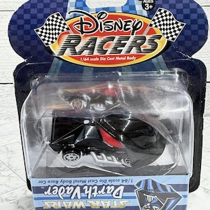 May include: A rustic wooden sign with the text "Welcome to our home" in white lettering. The sign features a distressed finish and a simple, inviting design, perfect for front door decor.