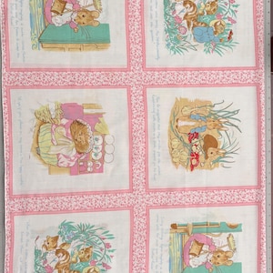 May include: A fabric panel featuring six illustrated squares with a pink floral border. Each square depicts a scene with animal characters, possibly from a children's story. The illustrations are in soft pastel colors, with text surrounding each image.