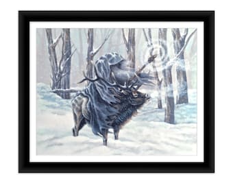 May include: A framed art print depicting a figure in a dark grey hooded cloak riding a large elk through a snowy forest. The figure holds a staff with a glowing circular effect. The scene features bare trees, white snow, and a black frame.