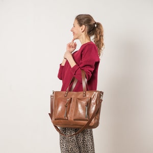 Handmade oversize leather handbag with two front pockets and long adjustable strap in brown veggie tanned leather image 1