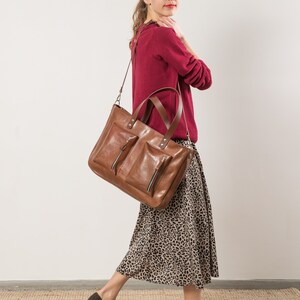 Handmade oversize leather handbag with two front pockets and long adjustable strap in brown veggie tanned leather image 4