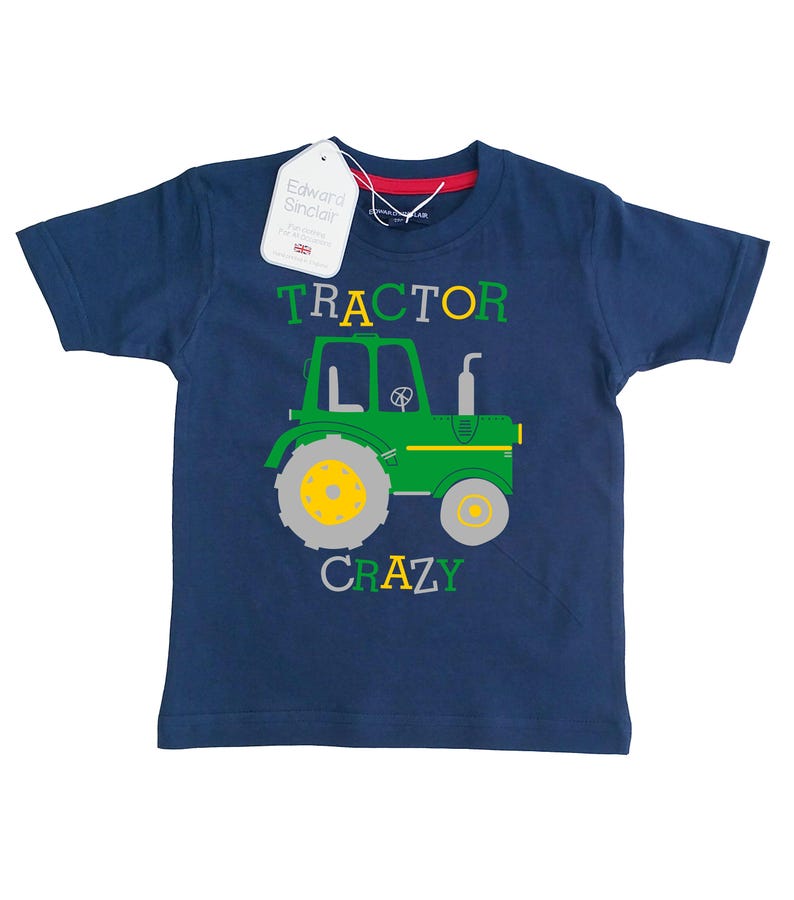 May include: A navy blue t-shirt with a green tractor graphic and the text "TRACTOR CRAZY".