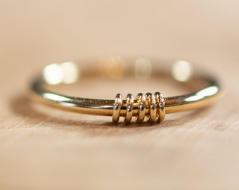 Dikke goldfilled ring met beweegbare oogjes