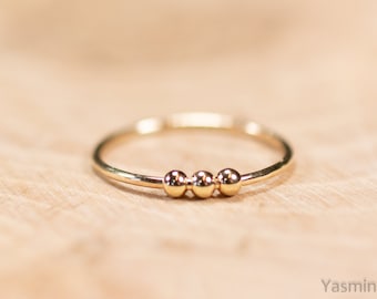 Goldfilled ring met beweegbare kralen