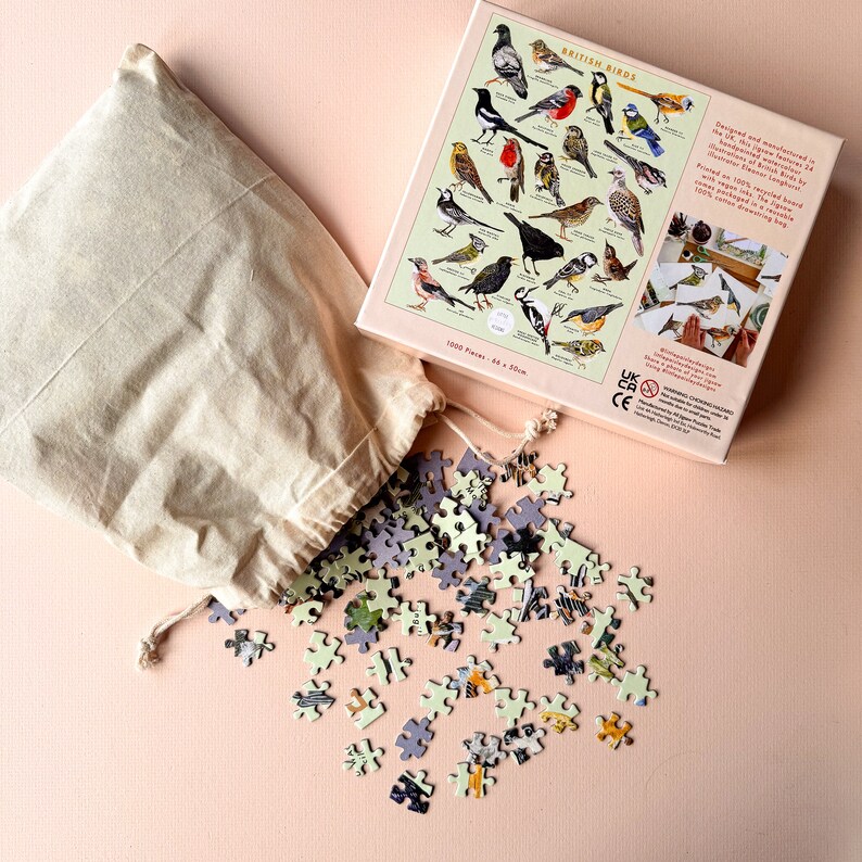 May include: A 1500 piece jigsaw puzzle of British birds in a brown paper bag. The puzzle box shows a colorful illustration of various birds with their names. The box is 44 x 30 cm.