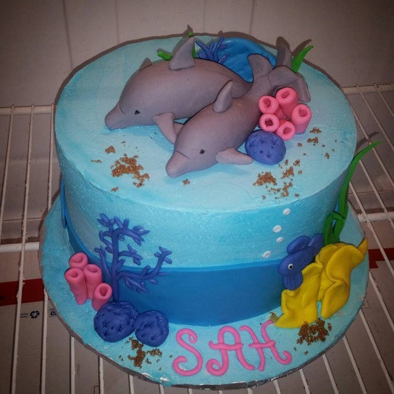 Dolphin cake topper made out of fondant