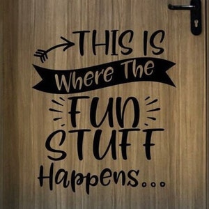 May include: A wooden door with a black vinyl decal that reads "This is where the fun stuff happens..." with an arrow pointing to the right.