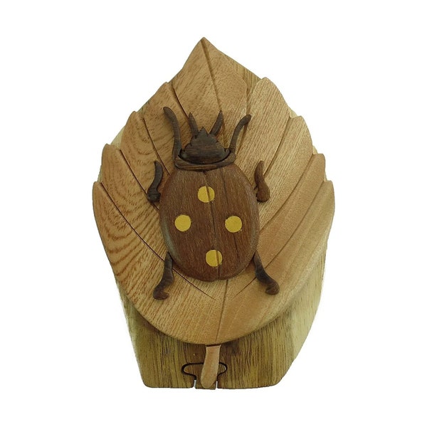 Beetle - Carver Dan’s hand-carved wooden gift box with a hidden red felt interior compartment.