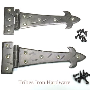 May include: Two black metal hinges with a decorative arrowhead design. Each hinge comes with a set of screws.