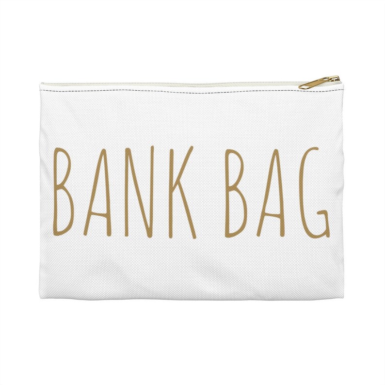 May include: White canvas zippered pouch with the text "BANK BAG" in gold lettering.