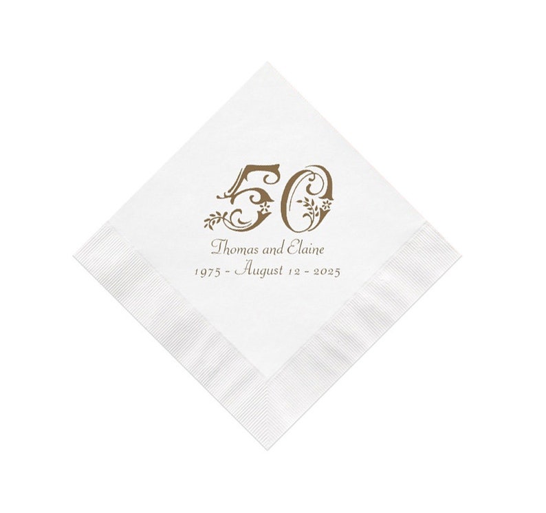 May include: White paper napkin with a brown design of the number 50 with floral accents. The text "Thomas and Elaine 1975 - August 12 - 2025" is printed below the number.