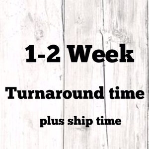 May include: Text on a white wooden background reads "1-2 Week Turnaround time plus ship time" in a bold, black font. The text is centered and stacked vertically.