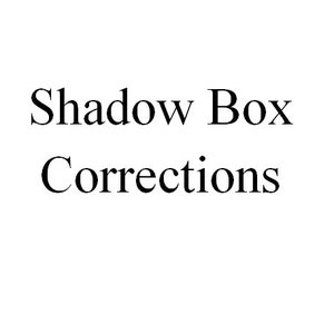May include: Text that reads "Shadow Box Corrections" in black font on a white background.