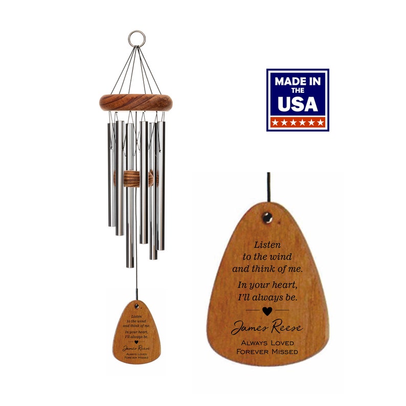 May include: A wooden wind chime with a teardrop-shaped wooden tag that reads "Listen to the wind and think of me. In your heart, I'll always be. James Reese ALWAYS LOVED FOREVER MISSED". The wind chime is made in the USA.