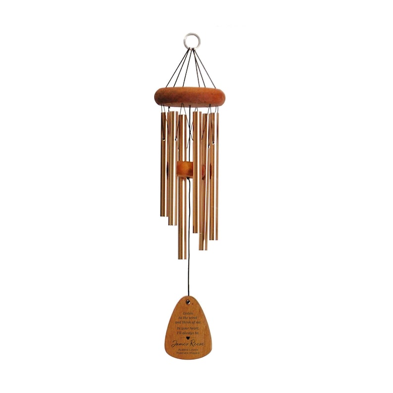 May include: A wooden wind chime with a heart-shaped tag that reads "Listen to the wind and the sound of the chimes.  I'll always be in your heart.  James Ryan, Forever Missed".
