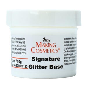 May include: A white jar of "Making Cosmetics Signature Glitter Base." The label includes the company logo, product name, and ingredient list. The jar contains 1.8oz / 50g of product.