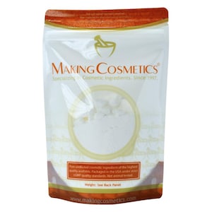 May include: A clear plastic pouch with a white powder inside, labeled "MAKING COSMETICS." The packaging includes text about cosmetic ingredients, quality standards, and the website www.makingcosmetics.com. The top of the pouch is orange.